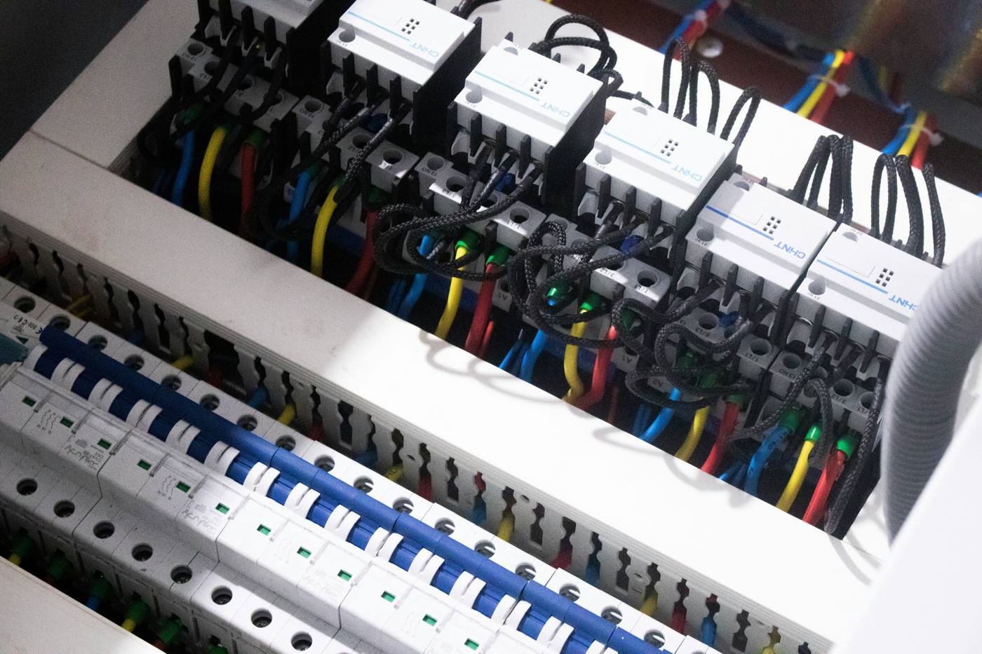 Neatly wired distribution board with breakers and contactors